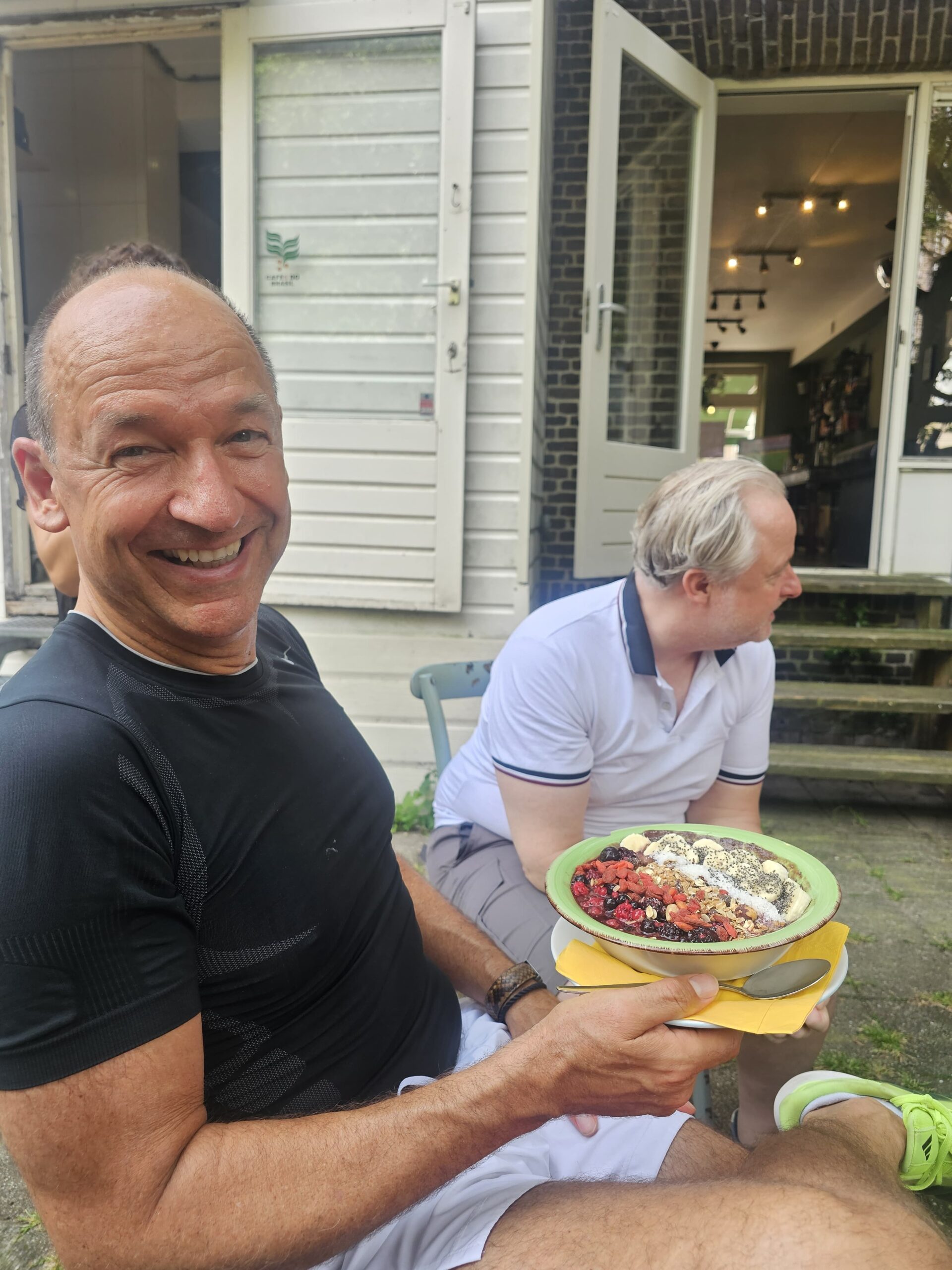 Guest holding açaí bowl